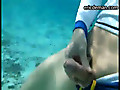 Flashes his cock underwater while swimming